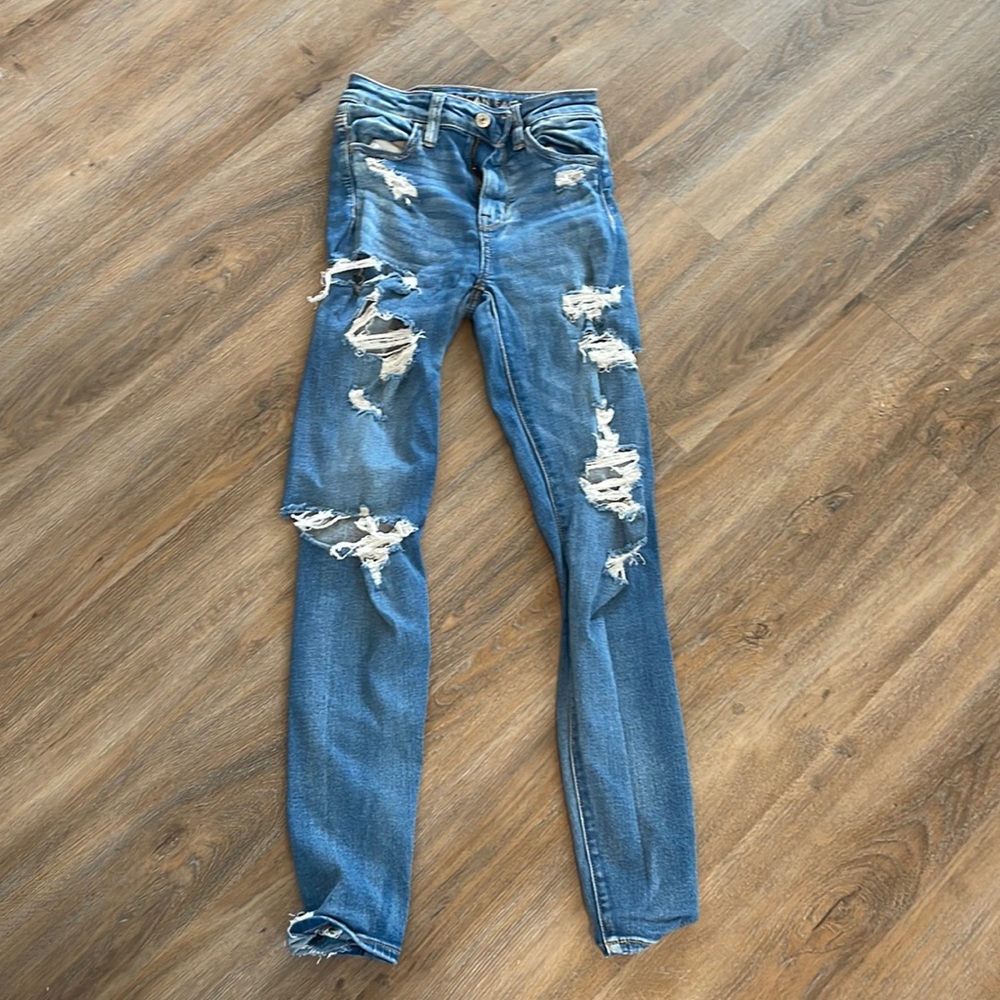 Medium wash skinny jeans with holes